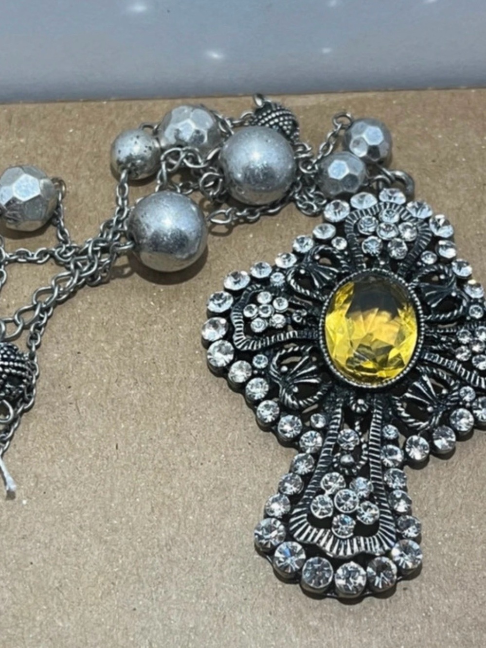 Vintage-Inspired Silver Cross Necklace with Yellow Gem